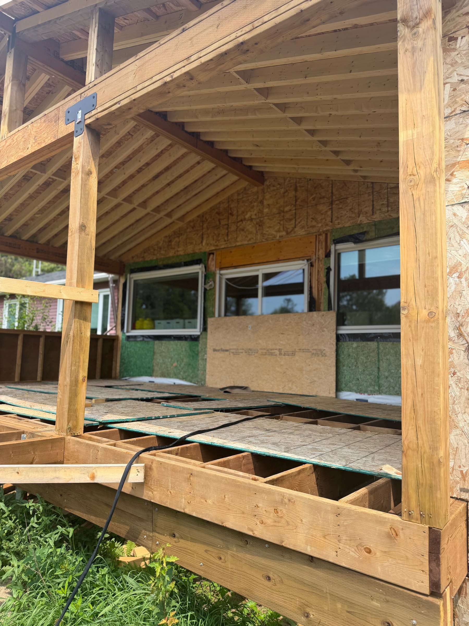 Detailed view of the rebuilt covered porch framing